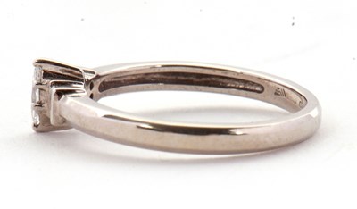 Lot 17 - An 18ct diamond ring, the central marquise...