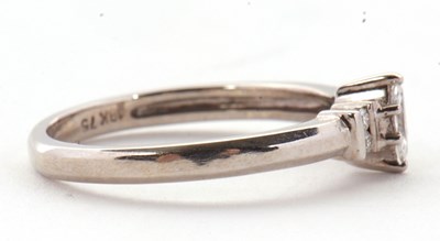 Lot 17 - An 18ct diamond ring, the central marquise...