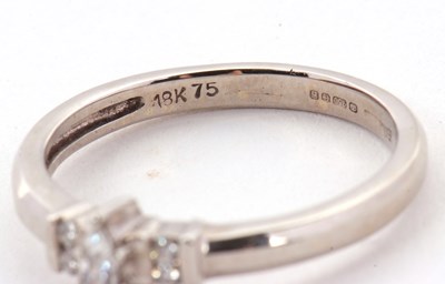 Lot 17 - An 18ct diamond ring, the central marquise...
