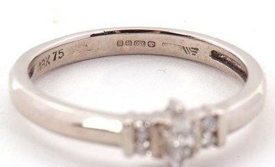 Lot 17 - An 18ct diamond ring, the central marquise...