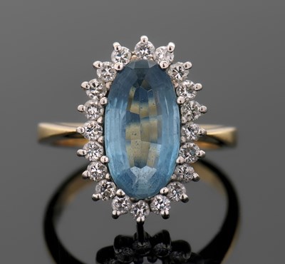 Lot 273 - An aquamarine and diamond ring, the oval...