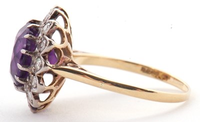 Lot 84 - An 18ct amethyst and diamond ring, the round...