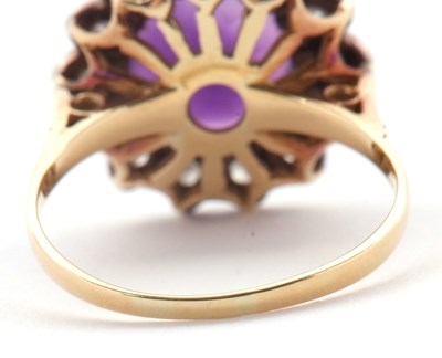 Lot 84 - An 18ct amethyst and diamond ring, the round...