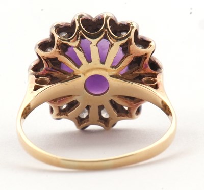 Lot 84 - An 18ct amethyst and diamond ring, the round...