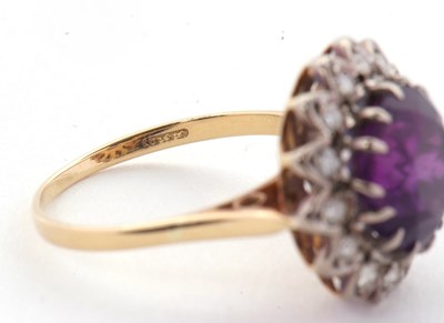 Lot 84 - An 18ct amethyst and diamond ring, the round...
