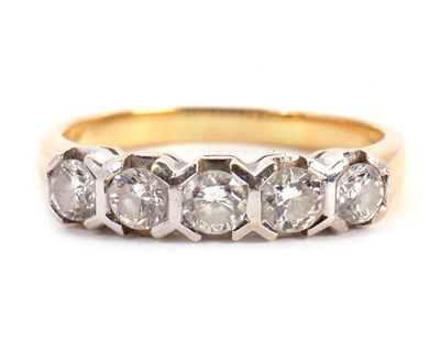 Lot 63 - A five stone diamond ring, the five round...