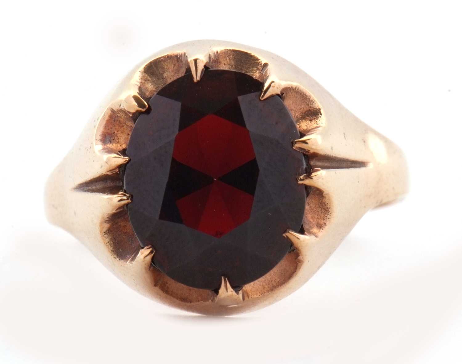 Lot 83 - A 9ct garnet ring, the oval claw munted garnet...