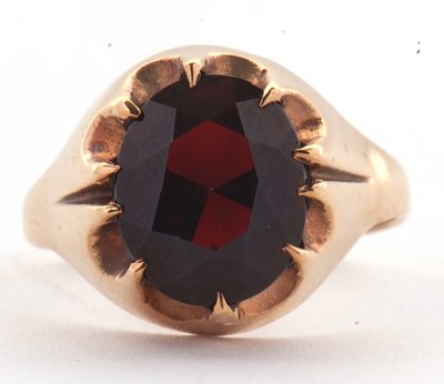 Lot 83 - A 9ct garnet ring, the oval claw munted garnet...