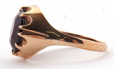 Lot 83 - A 9ct garnet ring, the oval claw munted garnet...