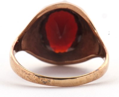 Lot 83 - A 9ct garnet ring, the oval claw munted garnet...