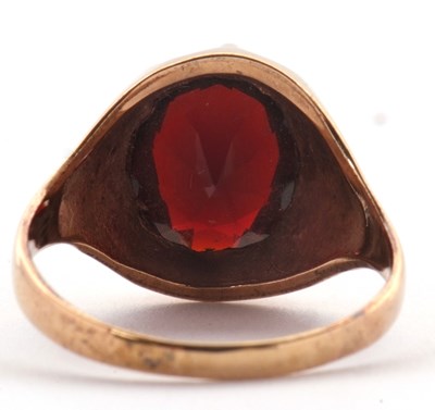 Lot 83 - A 9ct garnet ring, the oval claw munted garnet...
