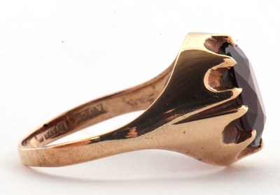 Lot 83 - A 9ct garnet ring, the oval claw munted garnet...