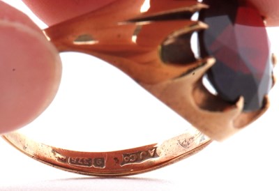 Lot 83 - A 9ct garnet ring, the oval claw munted garnet...