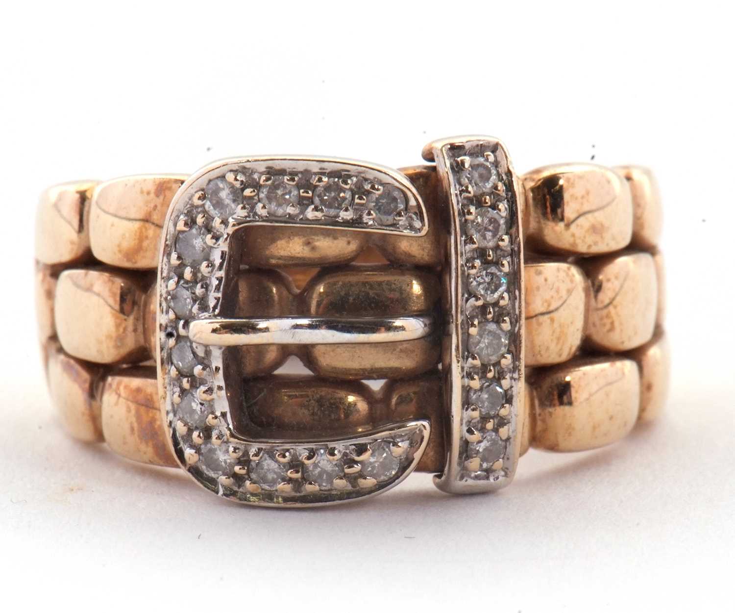 Lot 67 - A 9ct diamond buckle ring, the upper half with...