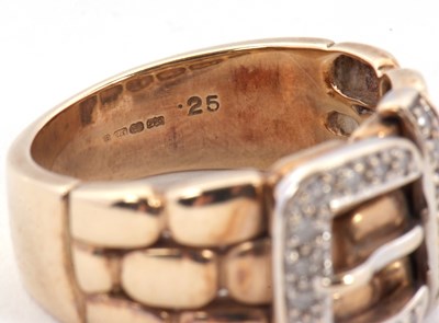 Lot 67 - A 9ct diamond buckle ring, the upper half with...