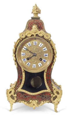 Lot 372 - A boule mantel clock of shaped form, the case...