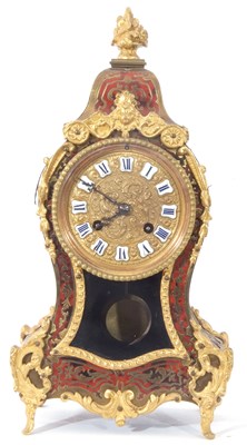 Lot 372 - A boule mantel clock of shaped form, the case...