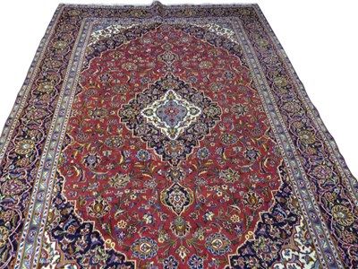Lot 498 - Iranian wool floor rug decorated with a large...