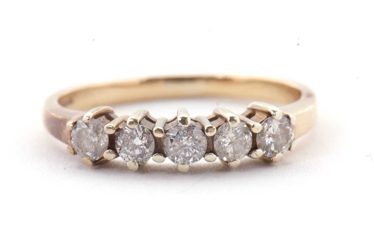 Lot 22 - A five stone diamond ring, the five round...