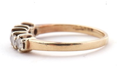 Lot 22 - A five stone diamond ring, the five round...
