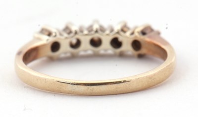Lot 22 - A five stone diamond ring, the five round...