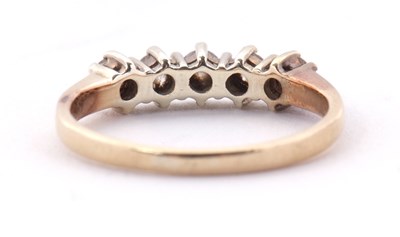 Lot 22 - A five stone diamond ring, the five round...
