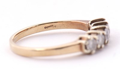 Lot 22 - A five stone diamond ring, the five round...