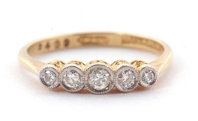 Lot 25 - A five stone diamond ring, the five graduated...