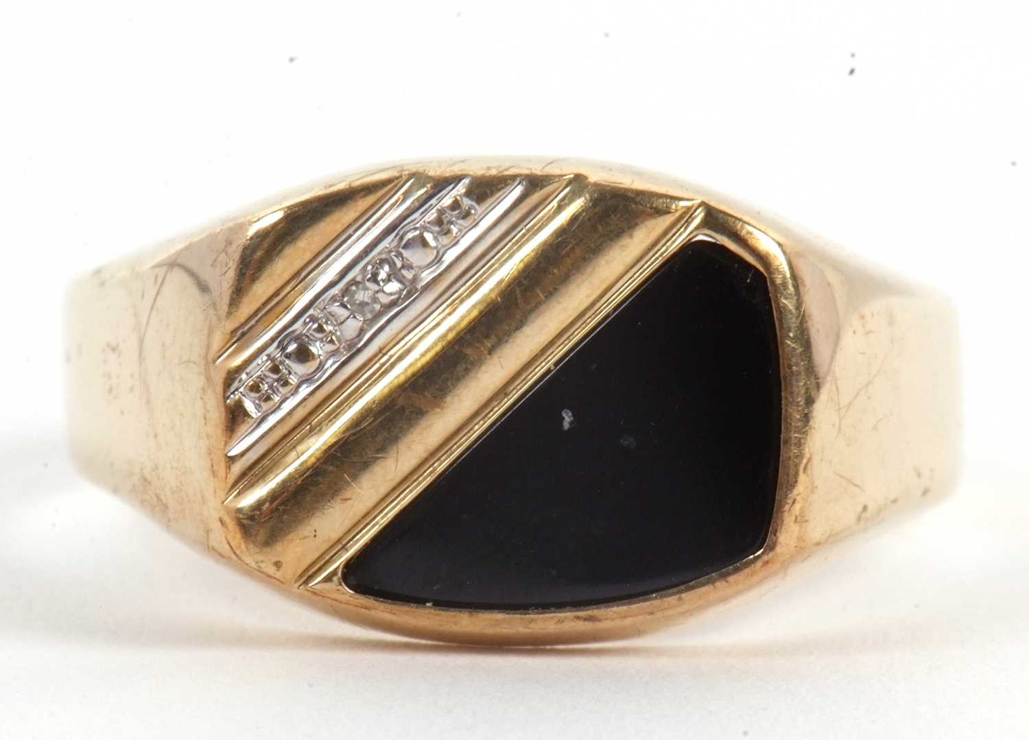 Lot 61 - A gentleman's onyx and diamond ring, set with...