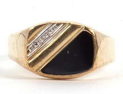 Lot 61 - A gentleman's onyx and diamond ring, set with...