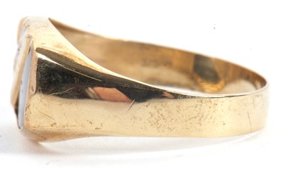 Lot 61 - A gentleman's onyx and diamond ring, set with...