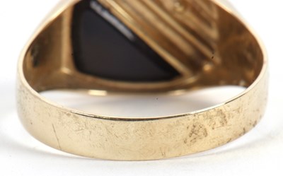 Lot 61 - A gentleman's onyx and diamond ring, set with...