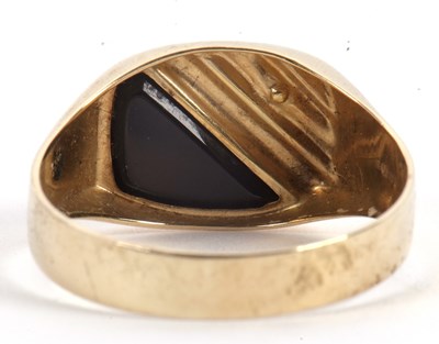 Lot 61 - A gentleman's onyx and diamond ring, set with...