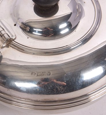 Lot 106 - An Edwardian silver teapot of compressed...