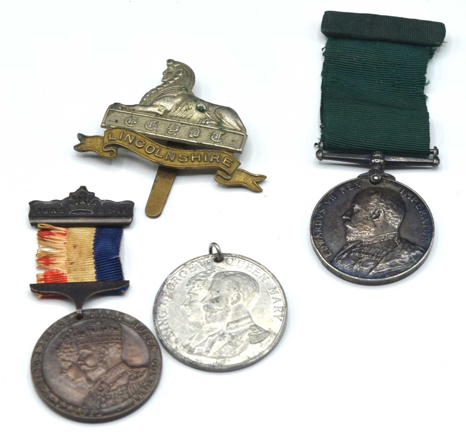 Lot 18 - ERVII Volunteer long service medal impressed...
