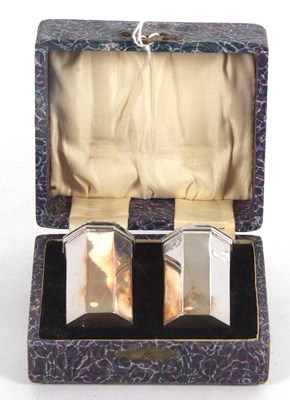 Lot 220 - A cased pair of George V silver peppers of...