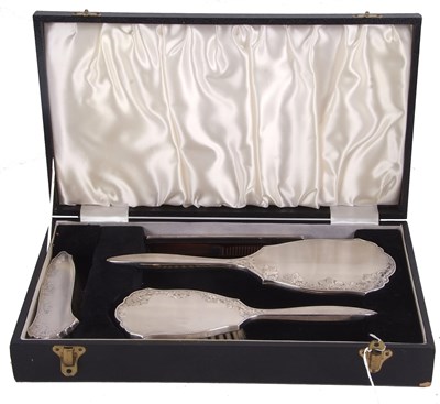 Lot 222 - An Elizabeth II cased silver backed dressing...