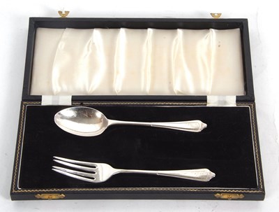 Lot 244 - A part cased silver christening fork and spoon,...