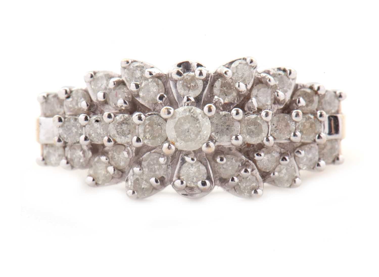 Lot 69 - A 9ct diamond cluster ring, set throughout...