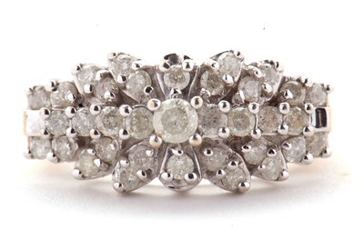 Lot 69 - A 9ct diamond cluster ring, set throughout...