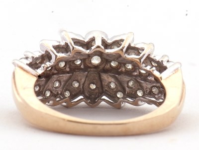 Lot 69 - A 9ct diamond cluster ring, set throughout...