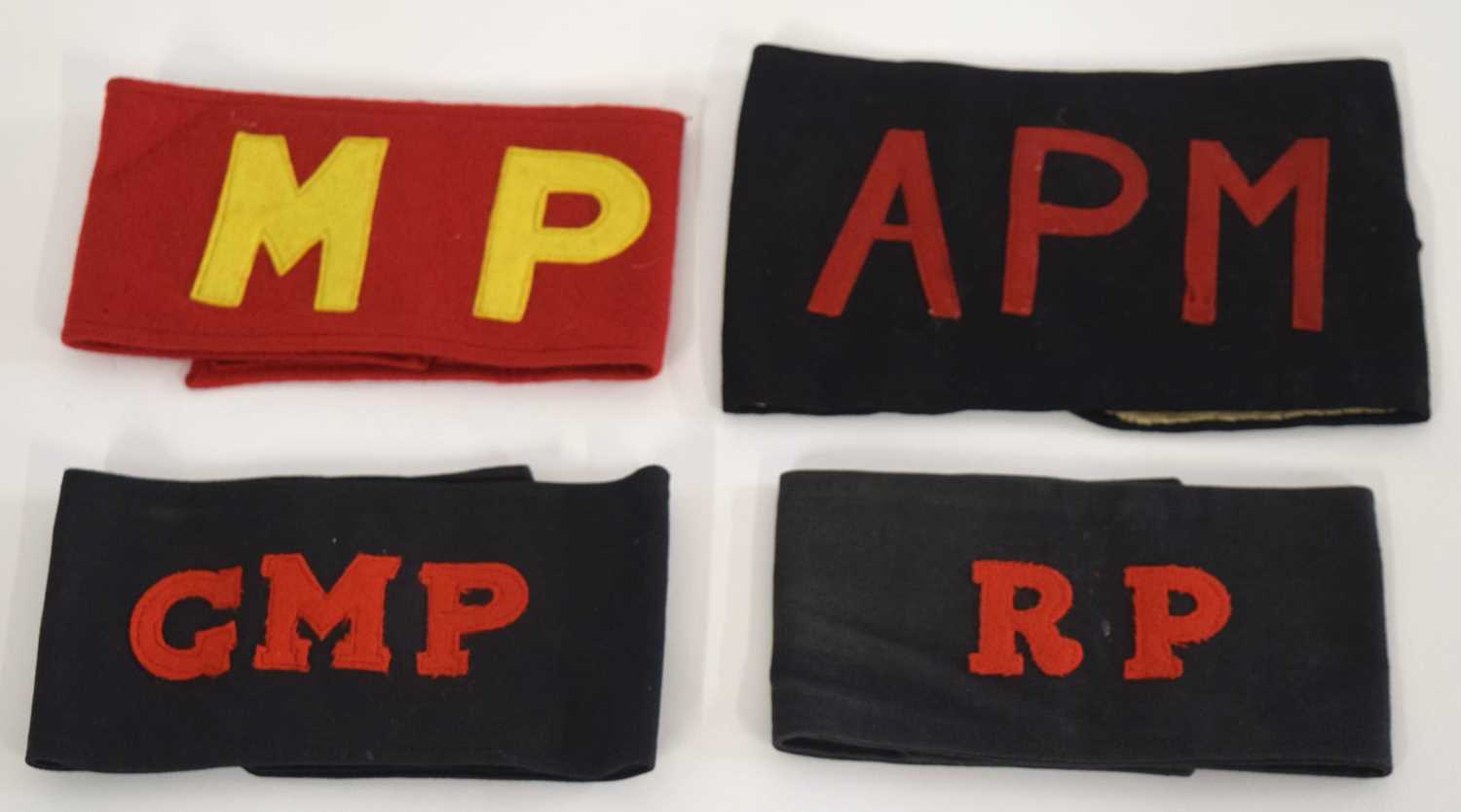 Lot 58 - Quantity of Four Military police armbands to...