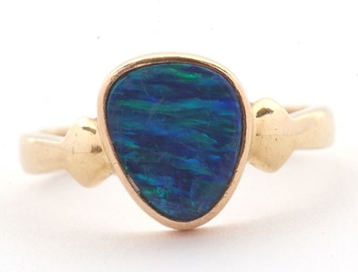 Lot 38 - A 14ct opal doublet ring, the asymetric opal...