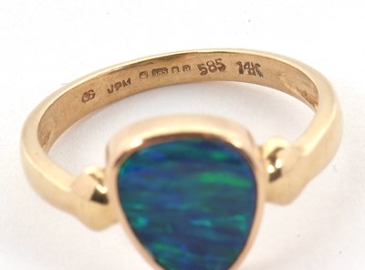 Lot 38 - A 14ct opal doublet ring, the asymetric opal...