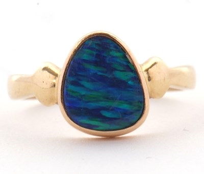 Lot 38 - A 14ct opal doublet ring, the asymetric opal...