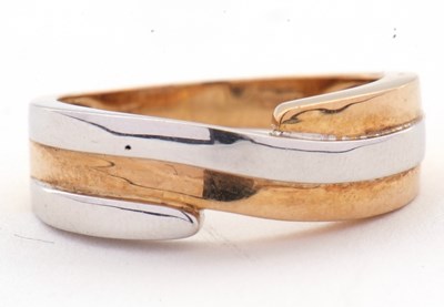 Lot 41 - A 9ct two tone crossover ring, the white and...