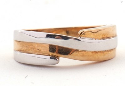 Lot 41 - A 9ct two tone crossover ring, the white and...