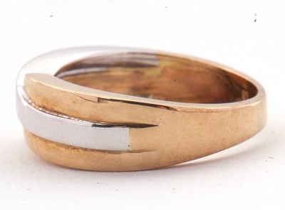 Lot 41 - A 9ct two tone crossover ring, the white and...