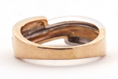 Lot 41 - A 9ct two tone crossover ring, the white and...