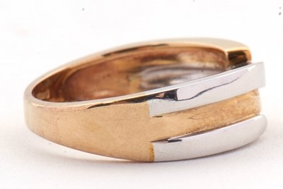 Lot 41 - A 9ct two tone crossover ring, the white and...